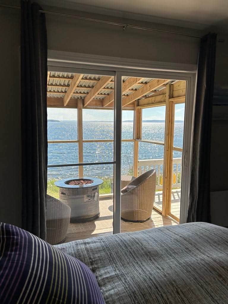 Watch the waves from your king bed