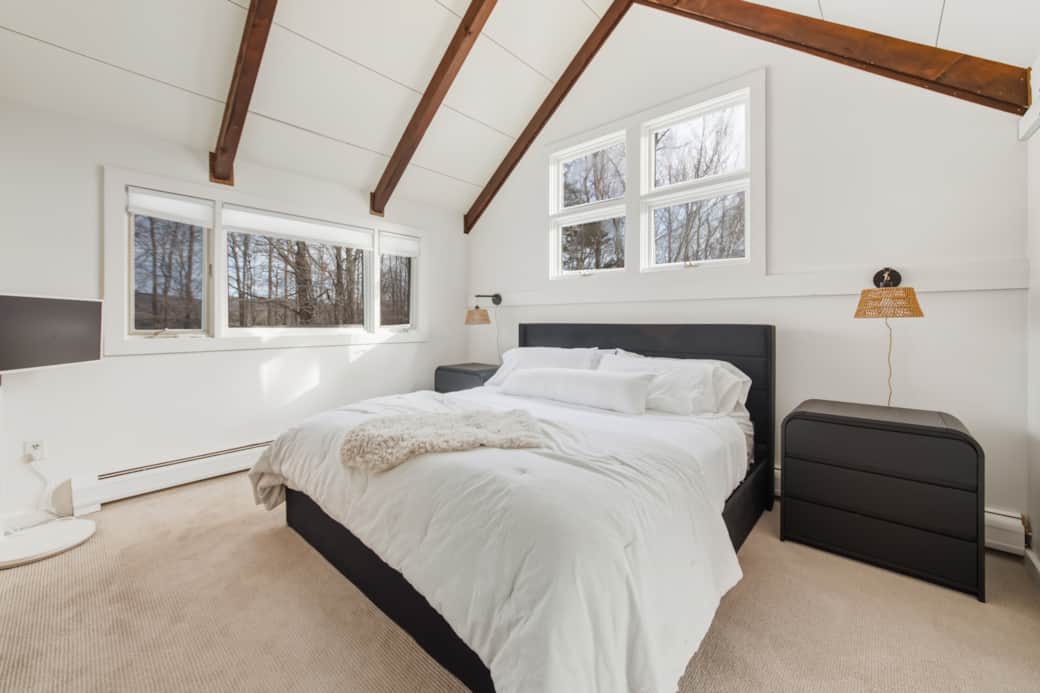 Vaulted ceilings and peaceful views in the primary bedroom