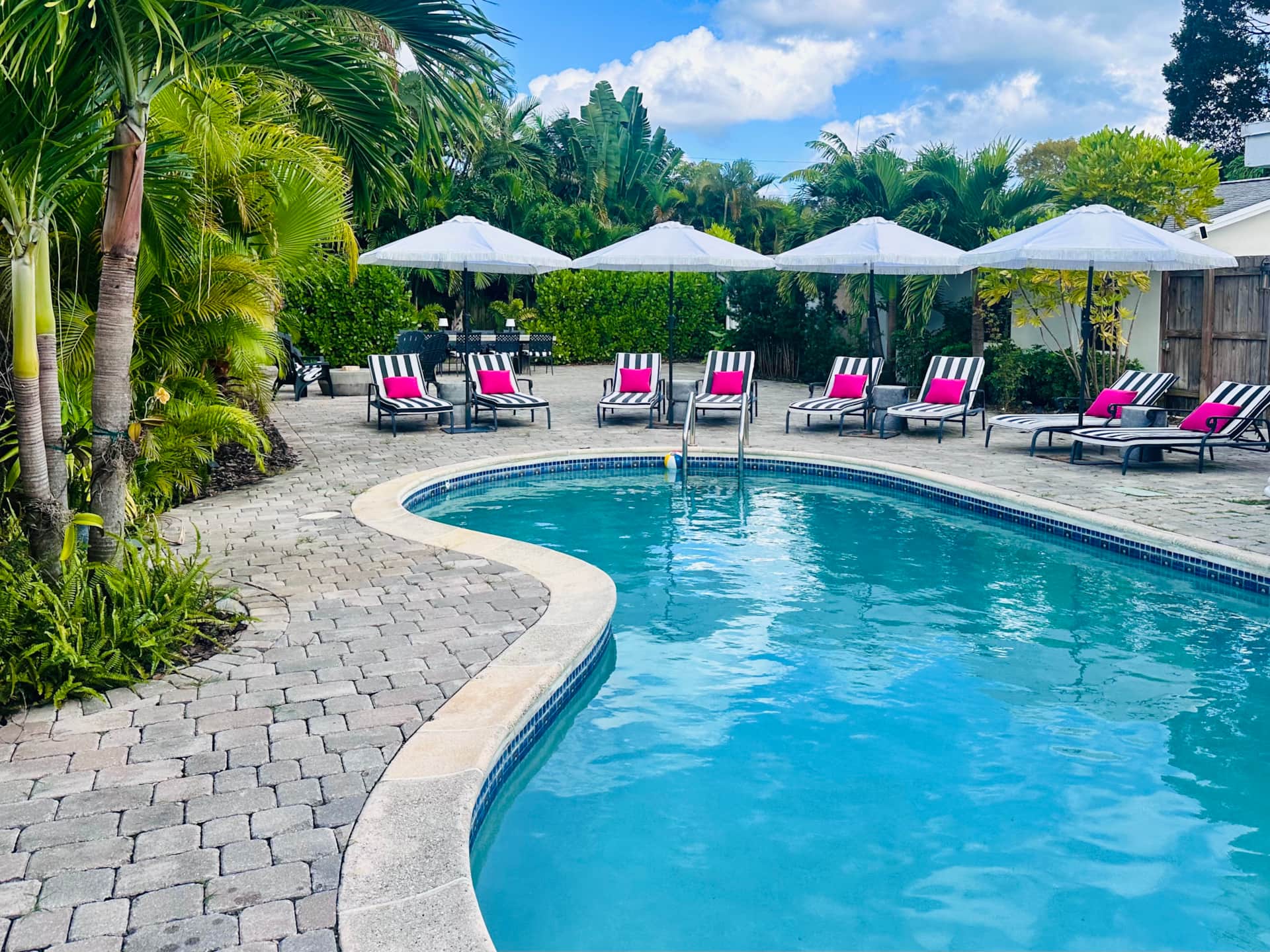 Renovated pool area at Casa Citron with new tumbled paver deck in Fort Lauderdale