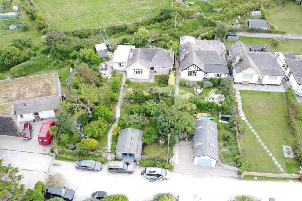 Aerial view showing parking for three cars.