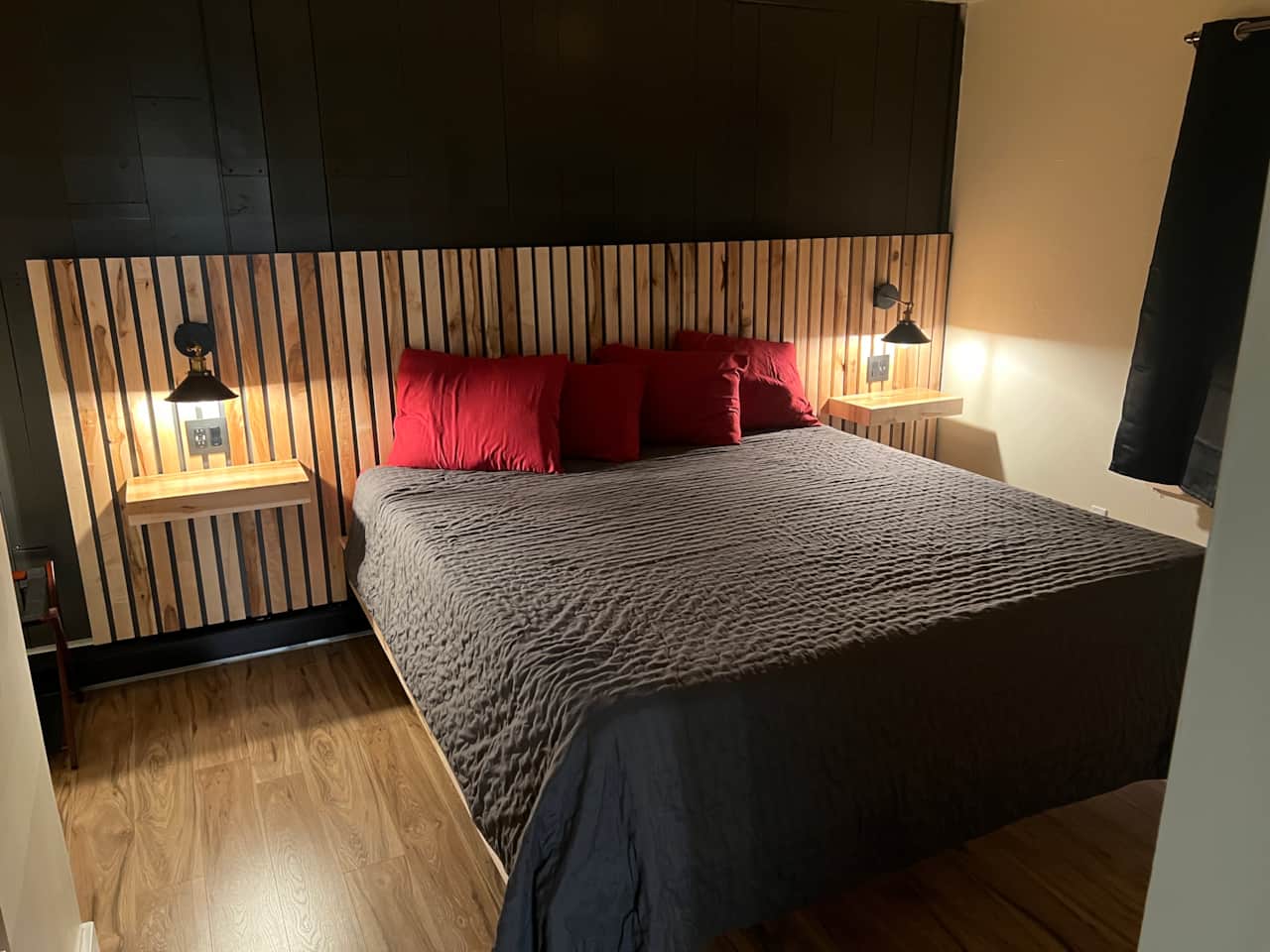 Comfortable Purple King Size bed with USB charging stations built into each sides night stand. 