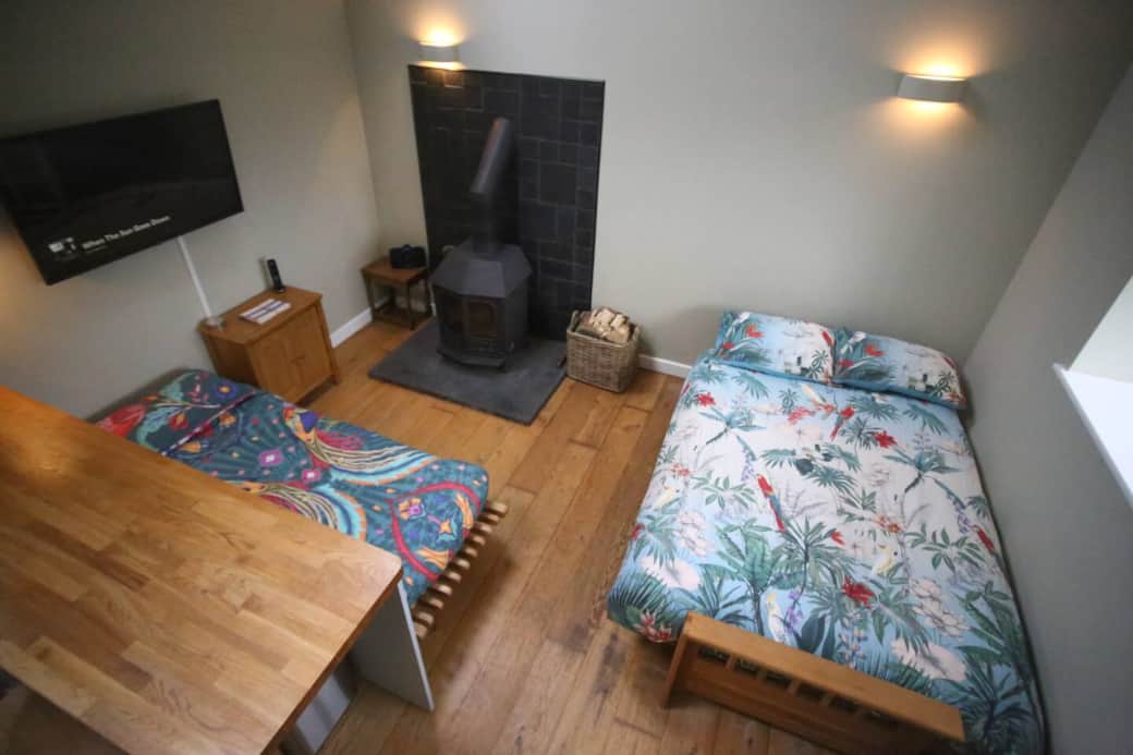 Lounge with the 2 sofa beds made up for sleeping.