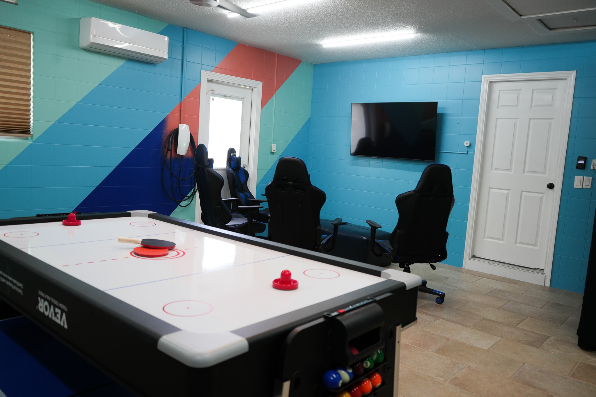 Fun and games await in the entertainment room, complete with an air hockey table for hours of enjoym