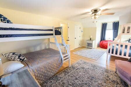 The 2nd floor bunkroom has 2 bunk beds with a full size on the bottom with twin size above.