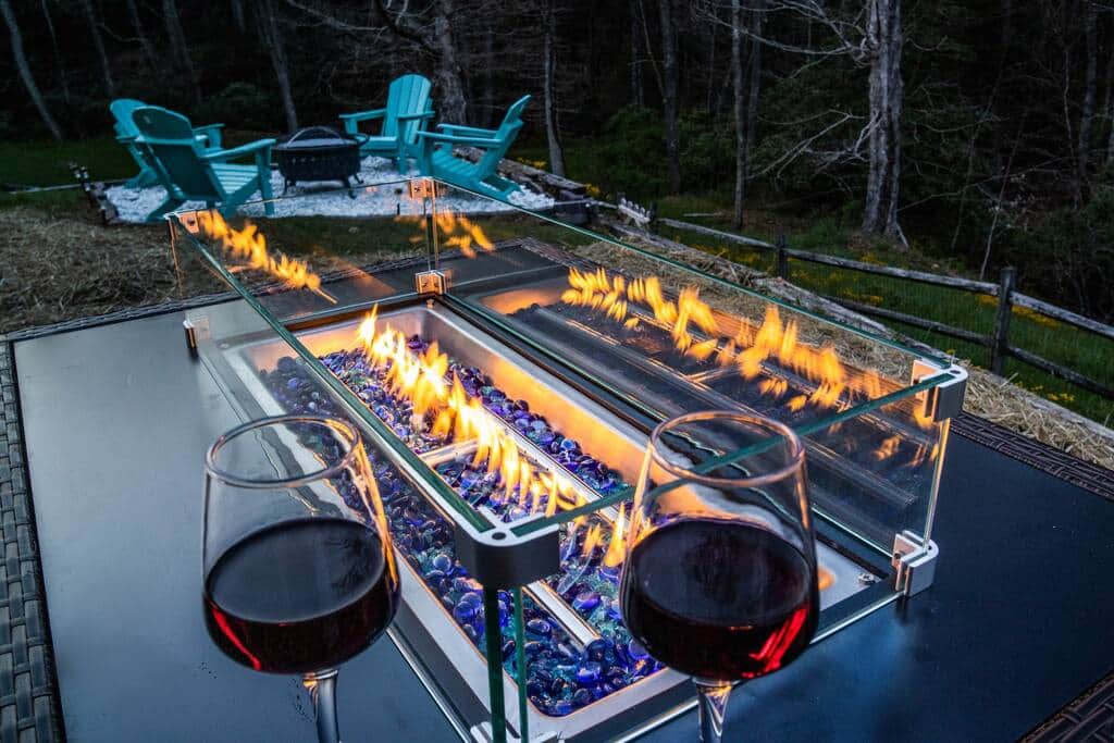 Enjoy cool mountain nights by the fire, overlooking a babbling stream on the edge of the property