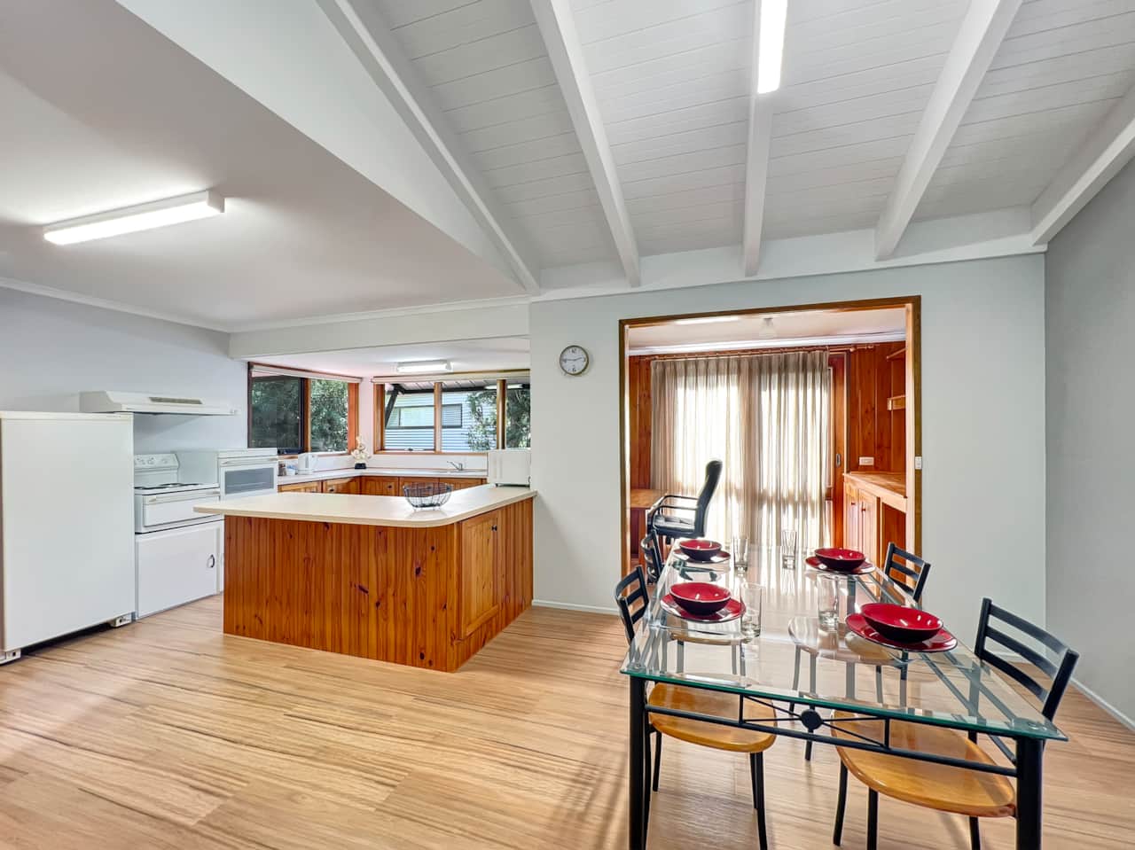 Versatile space integrating kitchen, dining, and office.