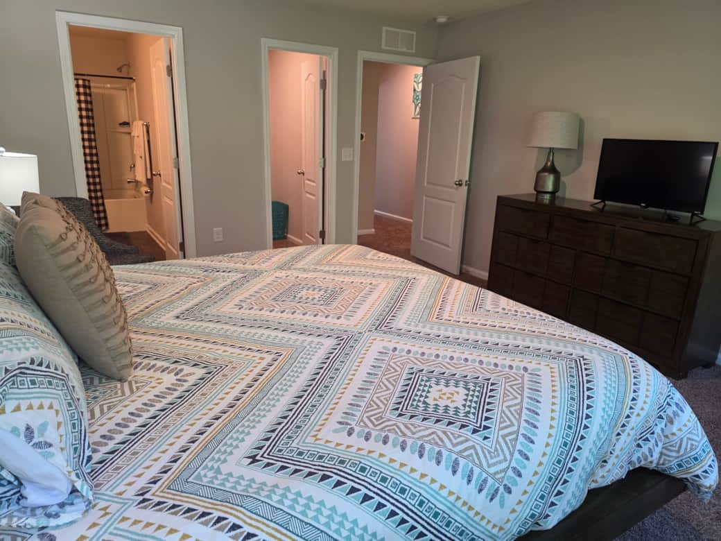 Spacious King Bed, walk-in closets,  ensuite bathroom.