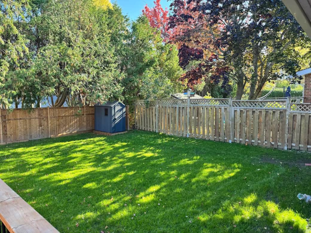 A small porch from the kitchen leads to a huge backyard that is fully fenced with safety and privacy in mind.