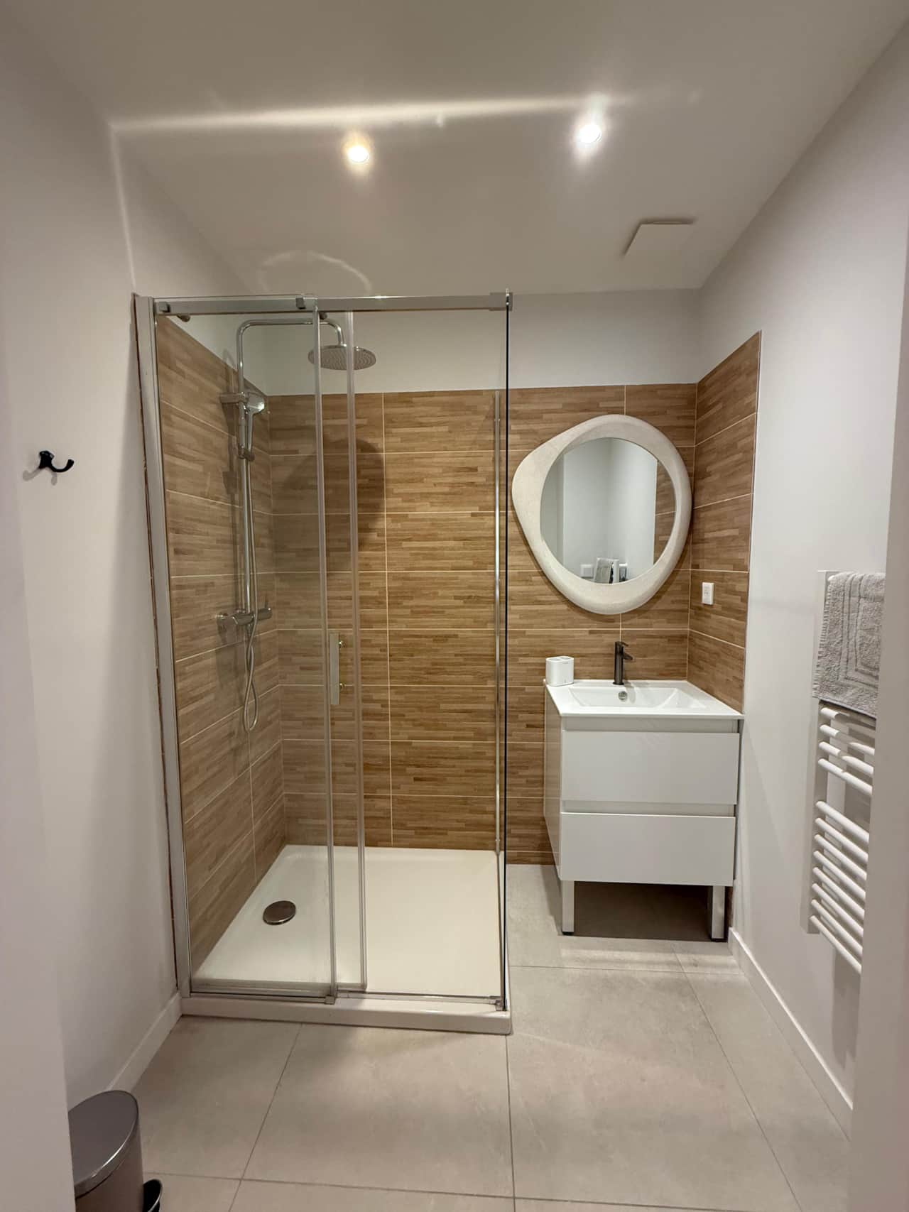 Bathroom with shower and towels provided.