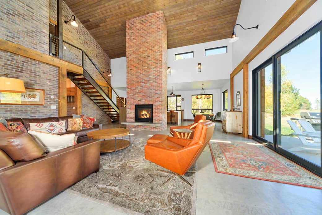 view from the sitting room towards the kitchen-floor to ceiling double sided gas fireplace