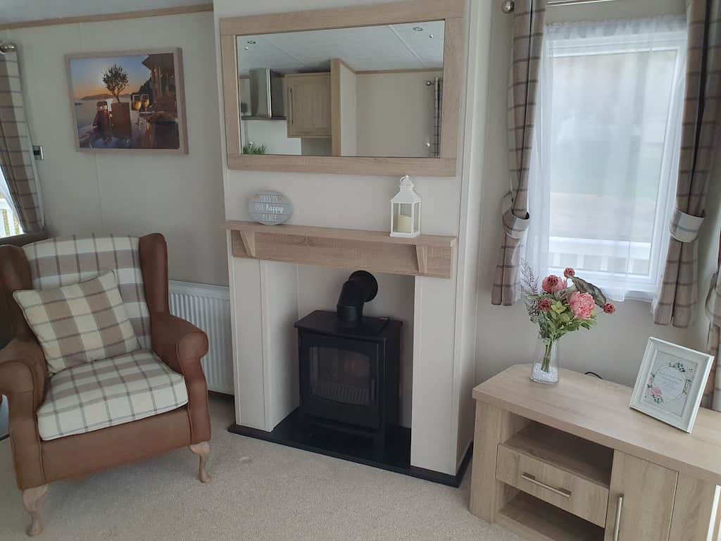 Fireplace and cosy armchair.