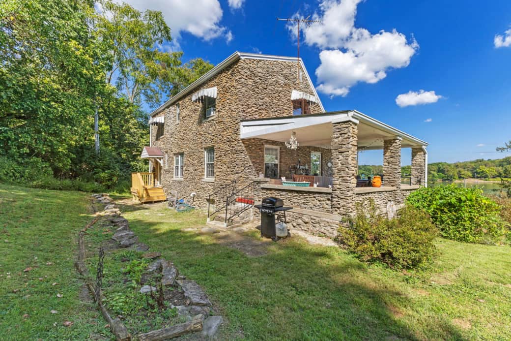 Side and back view of the house and gas grill.
