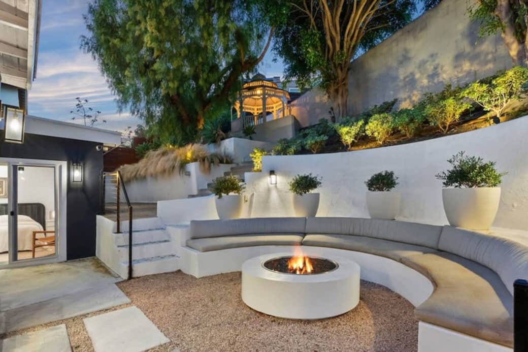 Outdoor seating area with built-in bench and fire pit Outdoor seating area with built-in bench and fire pit