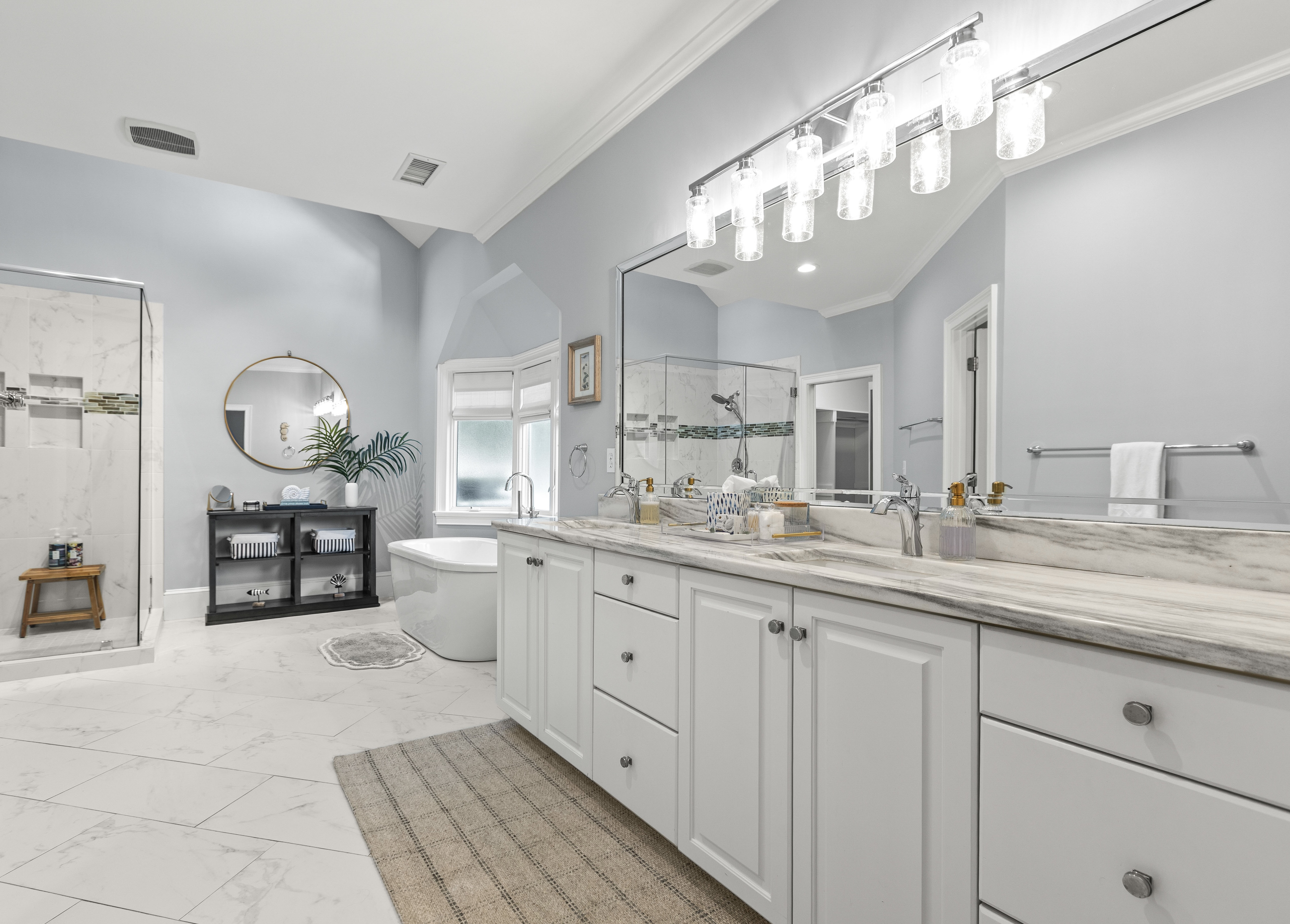 Double vanity, en-suite to the main-floor king bedroom