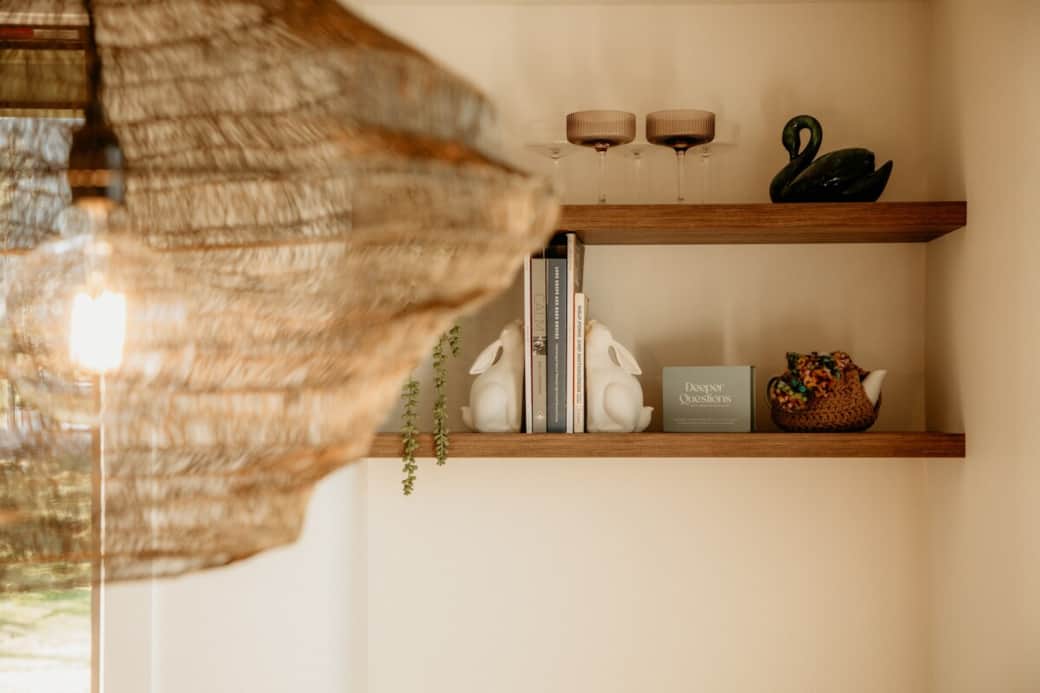What's more inviting than a window seat in the sunshine stocked with a selection of books, magazines, and interesting objects.