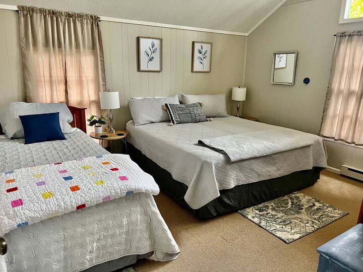 Another upstairs bedroom features a king and single bed.