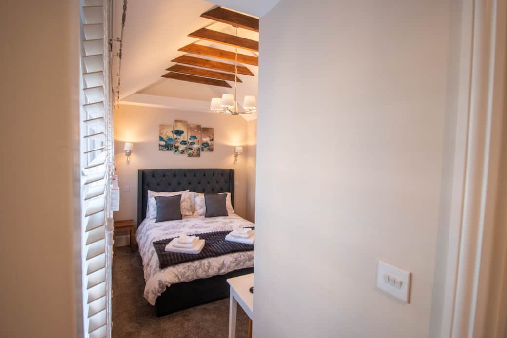 Bedroom with vaulted ceiling