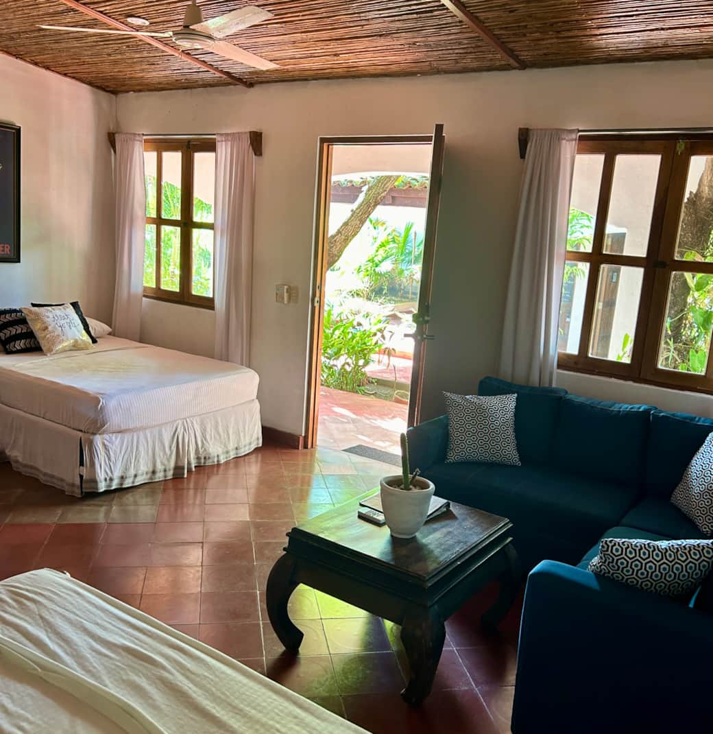Deluxe Double Suite with two double beds and sofa sectional Deluxe Double Suite with two double beds and sofa sectional