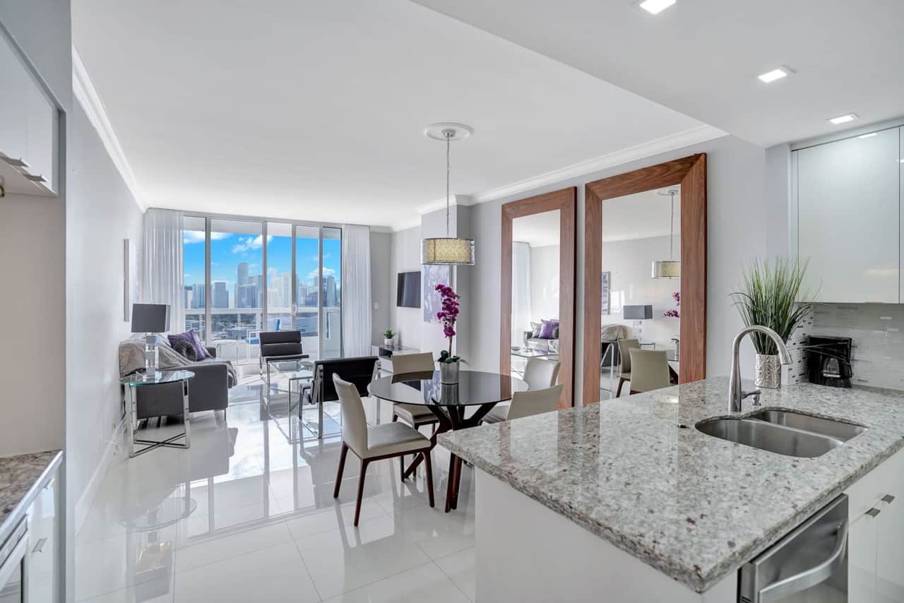 Living room, tv, balcony access, dining area