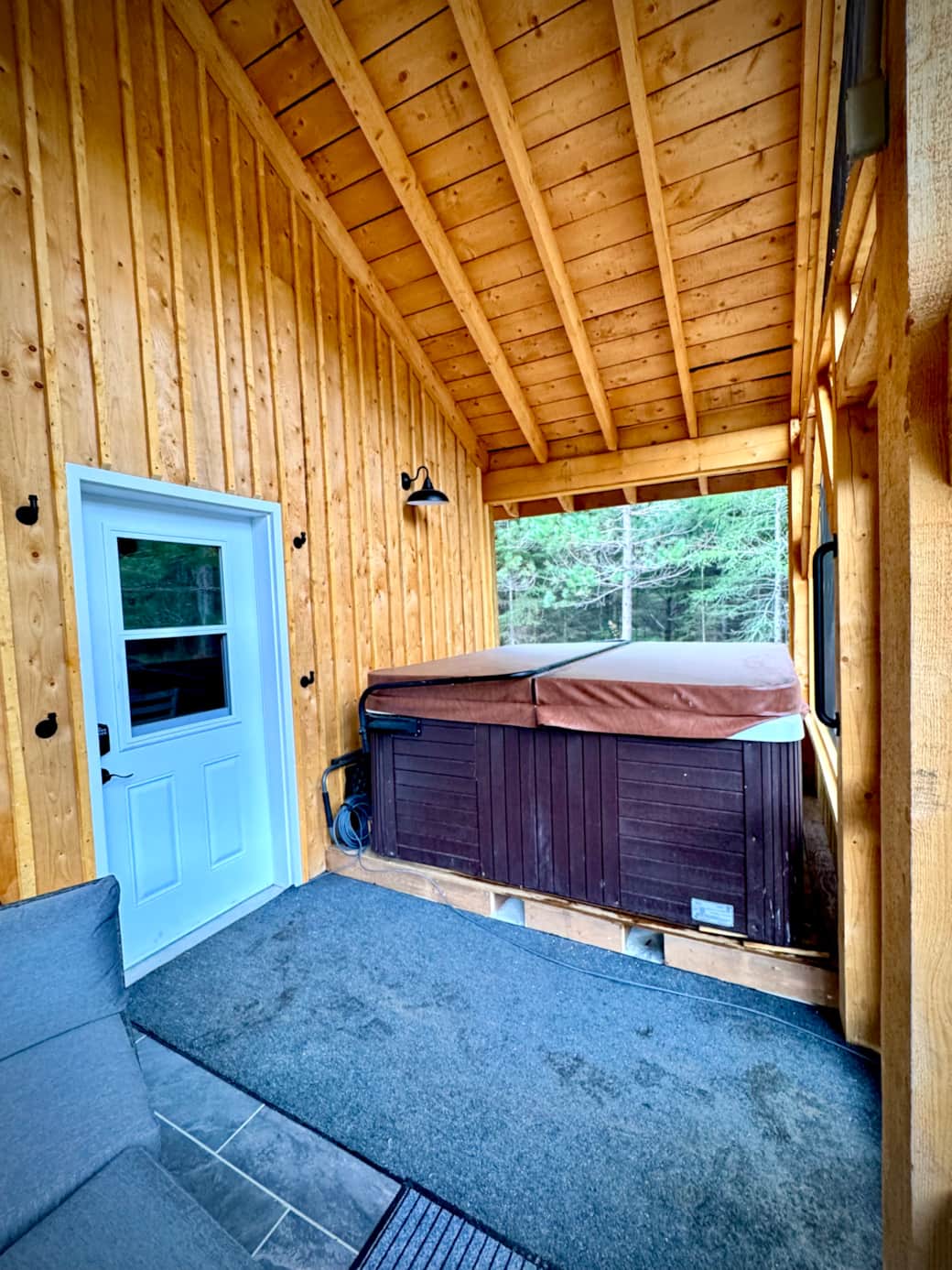 Screened in porch with hot tub