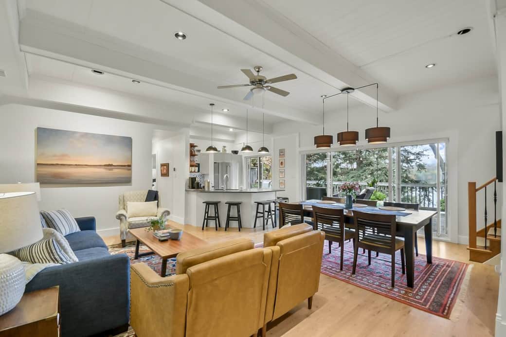 The living room comfortably seats 6. The view of the lake is gorgeous from the couch. It's easy to have a conversation with anyone in the kitchen.