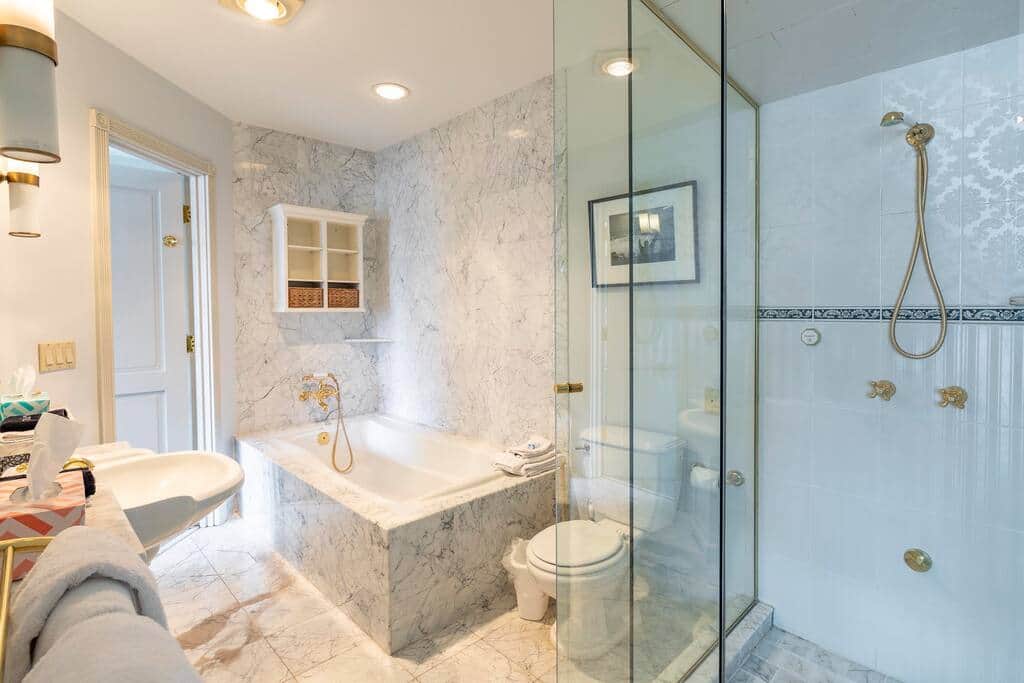 Relaxing and large marble bathroom with high-quality shower. Gets hot fast and has good pressure. 