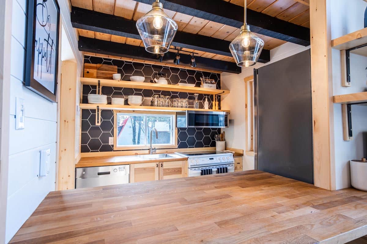 The kitchen has an open countertop into the dining & living areas