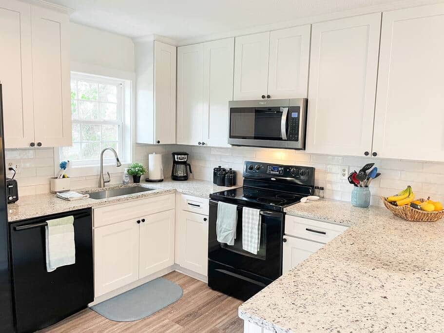 Main floor fully functioning kitchen with dishwasher and other appliances.