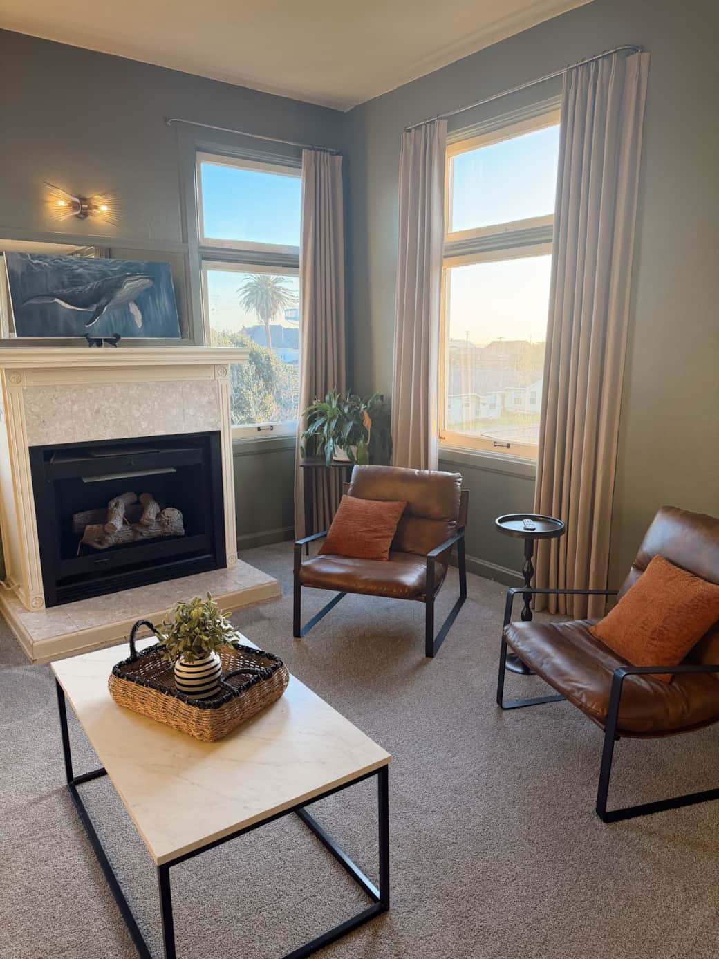 In room fireplace with seating area overlooking Main Street In room fireplace with seating area overlooking Main Street