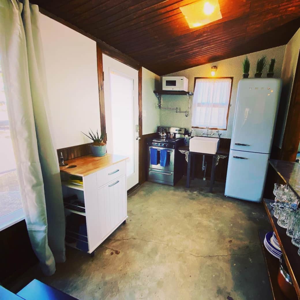 South Casita Kitchen & Bar With Farmhouse Sink, Vintage Barn Metal Ceiling & SMEG Appliances South Casita Kitchen & Bar With Farmhouse Sink, Vintage Barn Metal Ceiling & SMEG Appliances