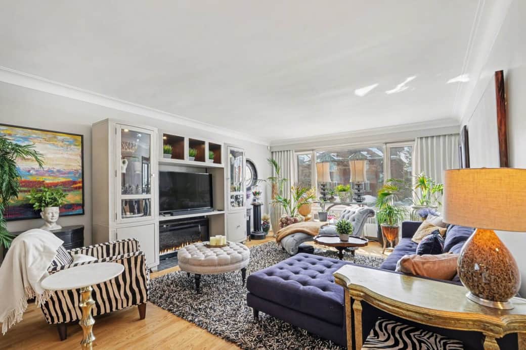 Sophisticated shared lounge with designer furniture & ample natural light