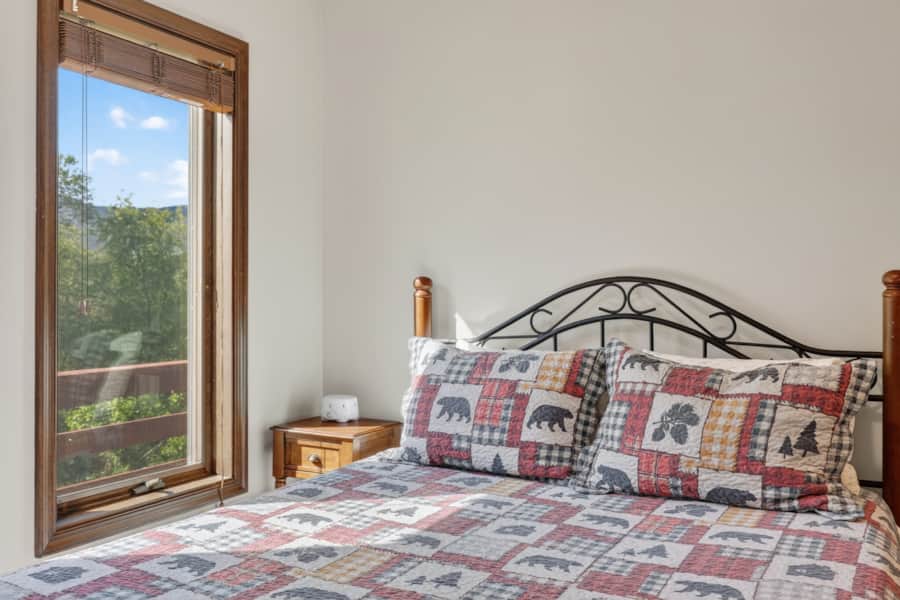 Queen bed by the window