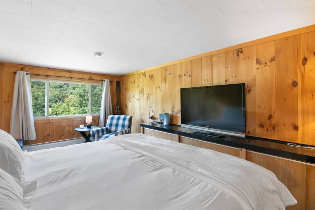 Unit 1 King bedroom with blackout shades, walk-in closet and smart TV