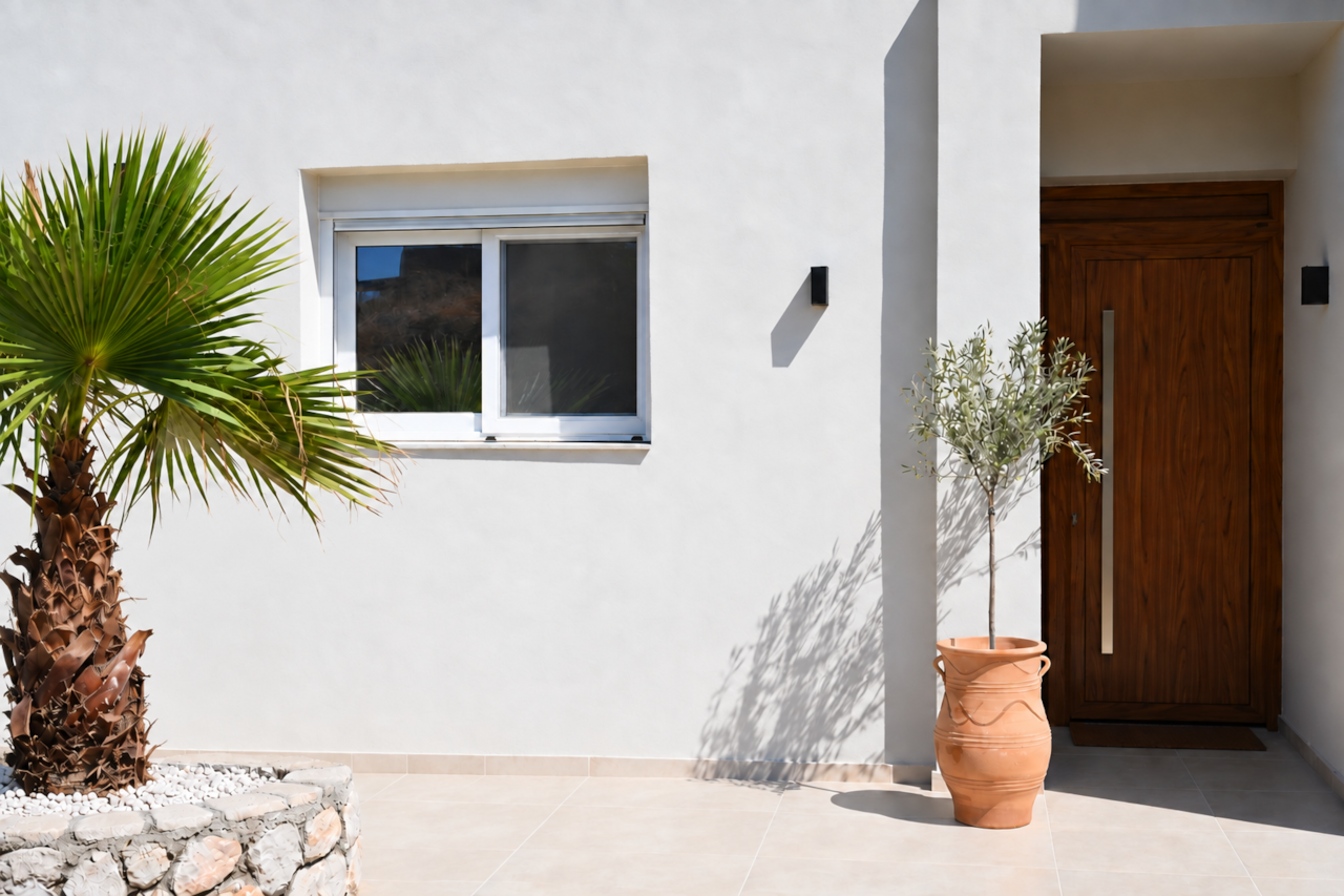 The palm-lined entrance to Villa Pastida II in Pastida, Rhodes.