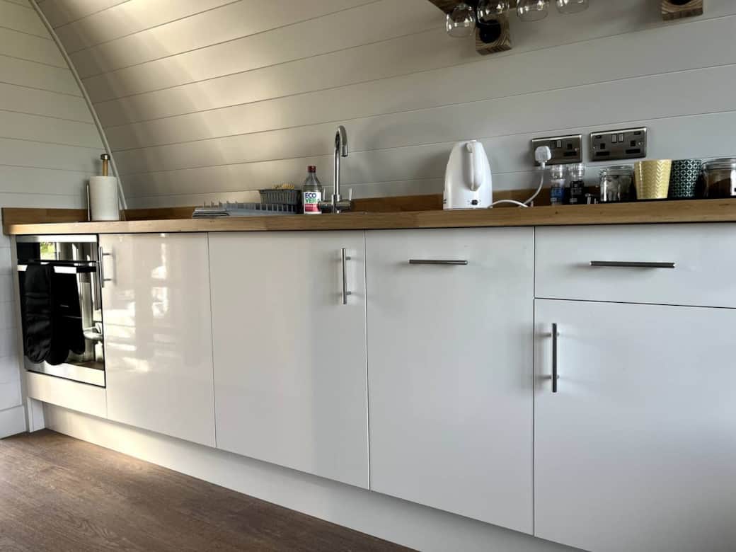 Efficient kitchen with cooker, 2 ring hob, and fridge