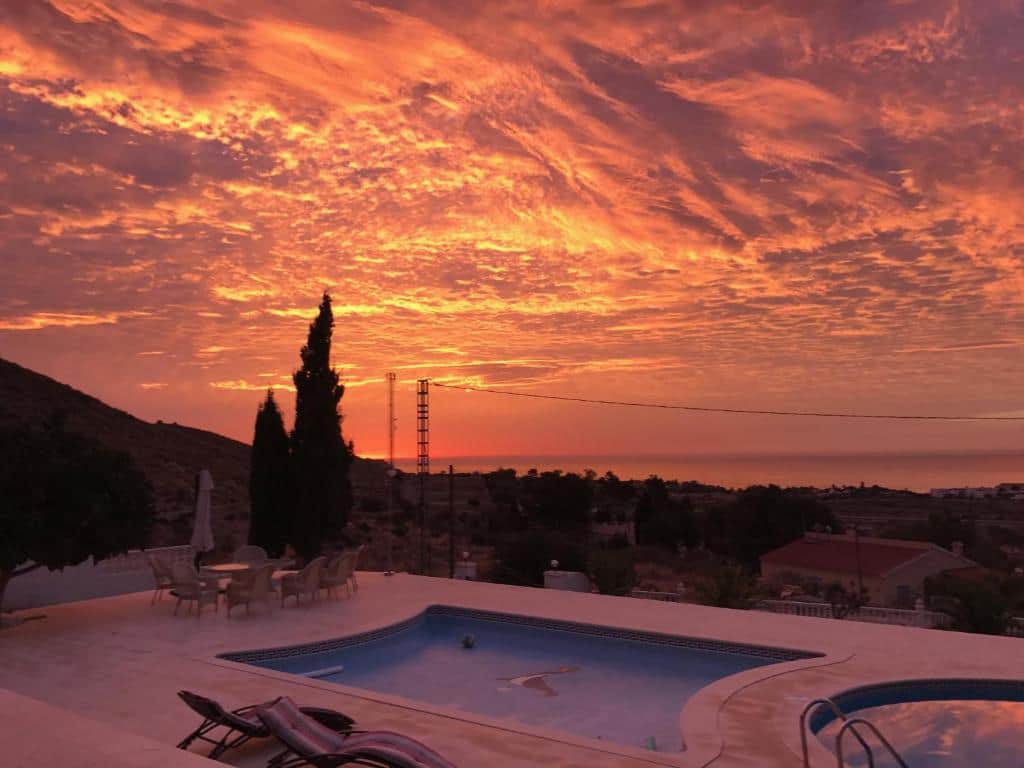 Golden sunset over pool