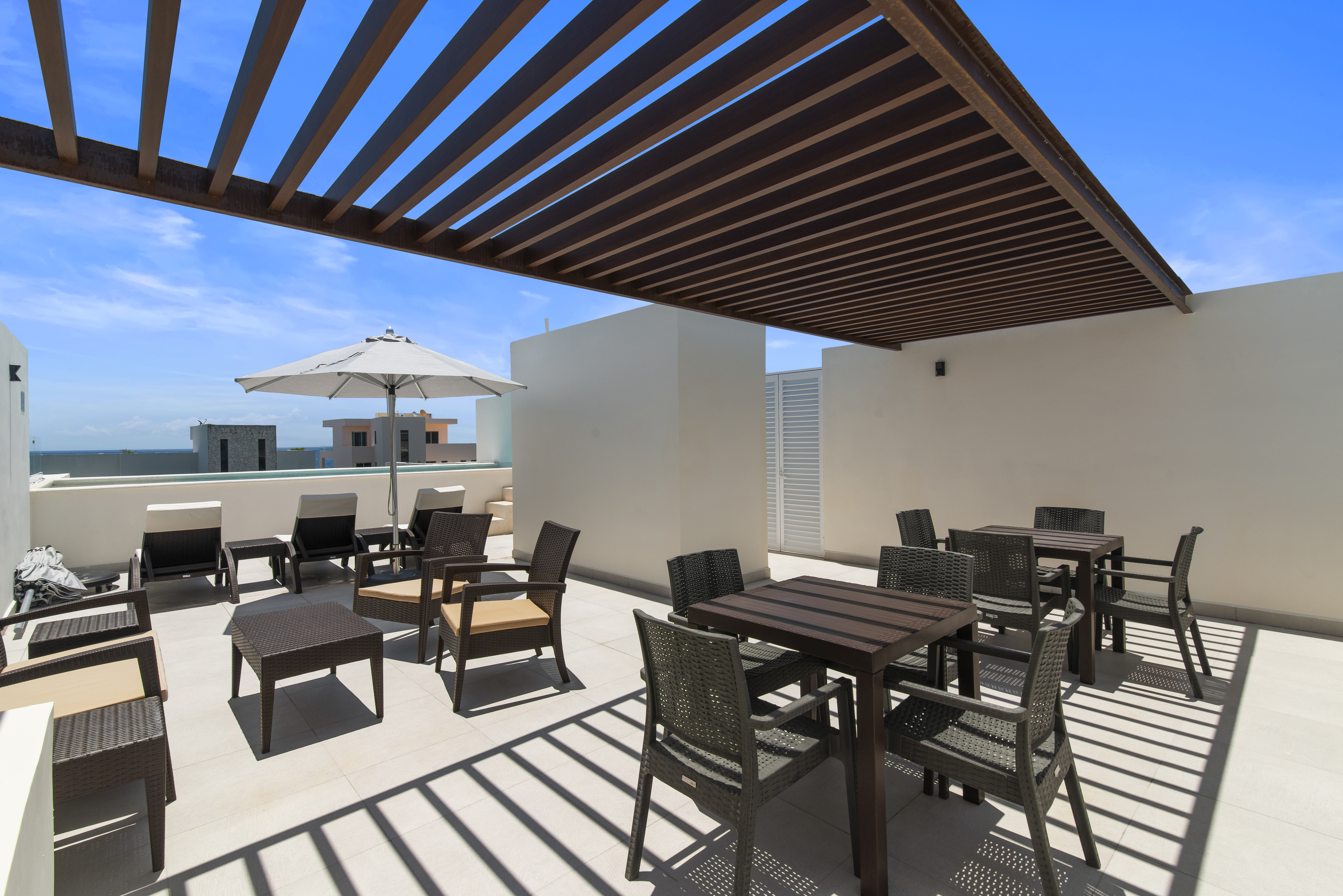 Seven rooftop pools with stunning Caribbean Sea views, loungers, umbrellas, and plenty of space to r