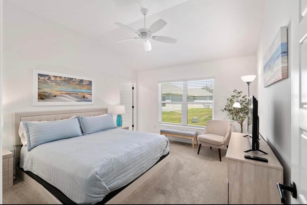 Primary bedroom with King bed, walk in closet and ensuite bathroom