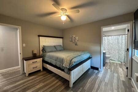 Cozy bedding with a new remodeled master bathroom. 