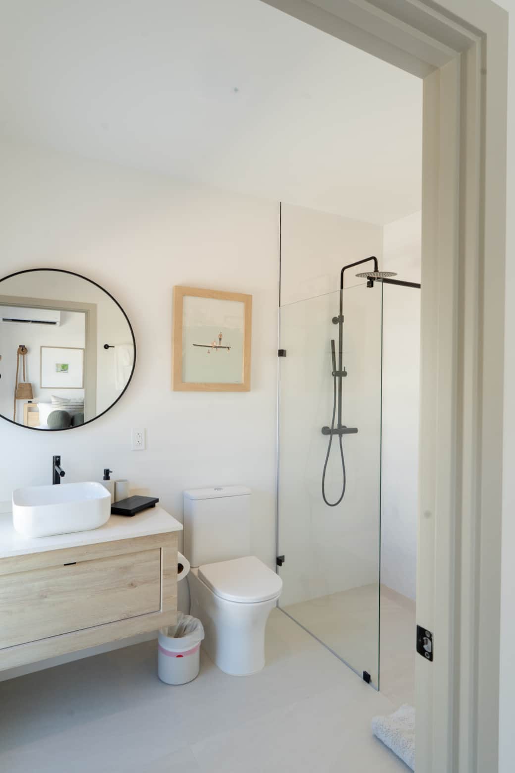 Calming ensuite retreat with warm lighting and stylish details.