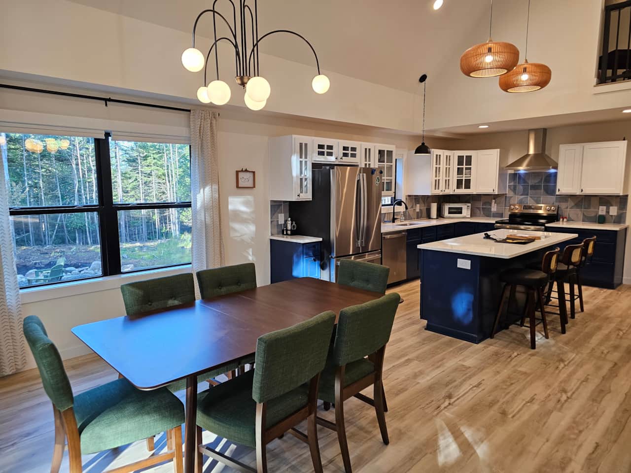 Dining room and kitchen overlook the firepit in the back yard.