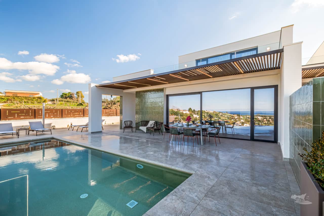 Villa’s stunning design features a spacious veranda, a panoramic terrace, and elegant outdoor areas.