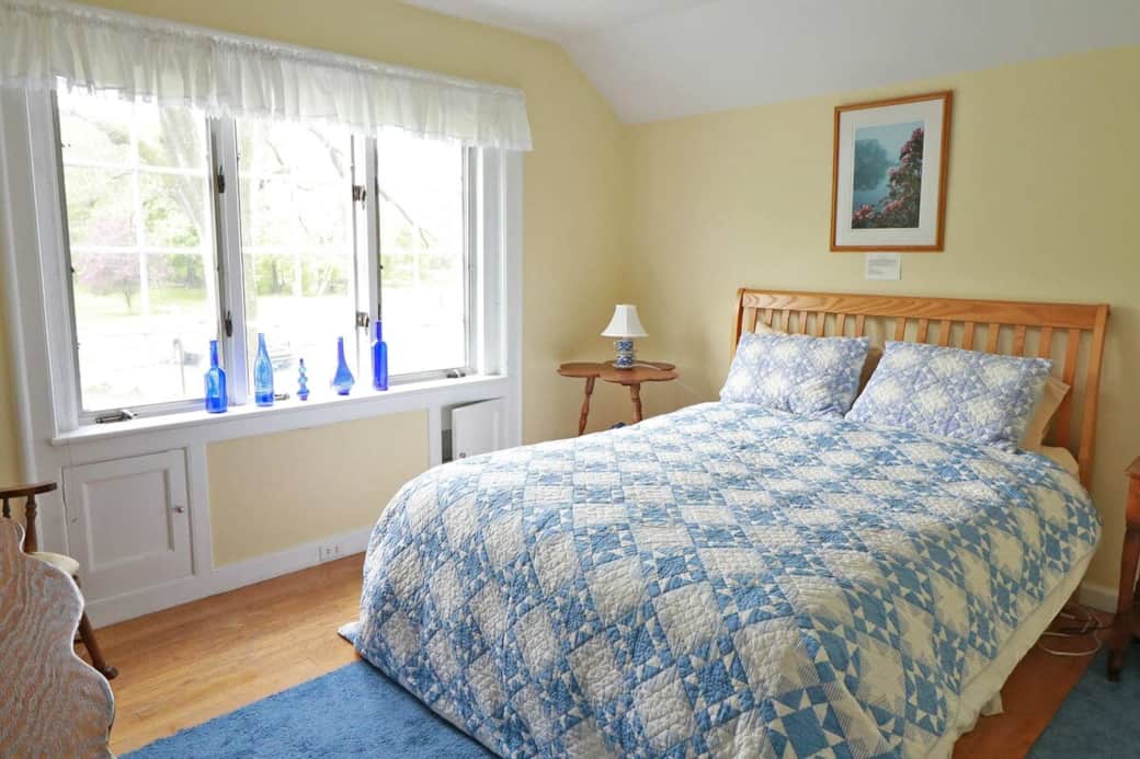 The Yellow Room is a bright room on the southwest side of the house, upstairs off the balcony overlooking the Great Room. It has a queen-size bed, private bathroom, and views of the mountains and fields.