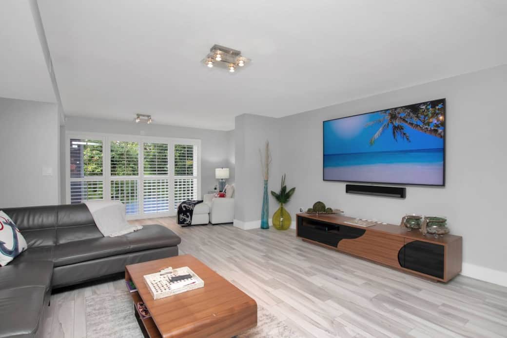 Main floor Great room with 82" flat screen Tv and Sonos surround sound system. You may be able to play your own music library from your phone with the Sonos app.