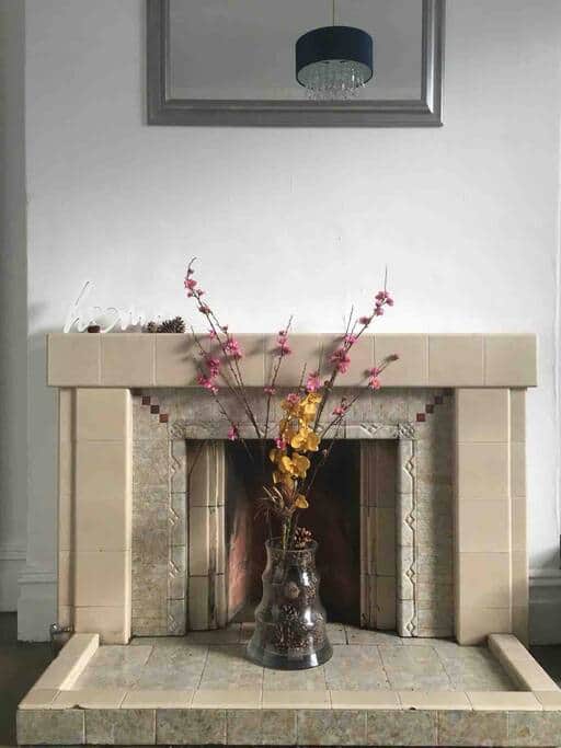 The traditional fire place in the living room