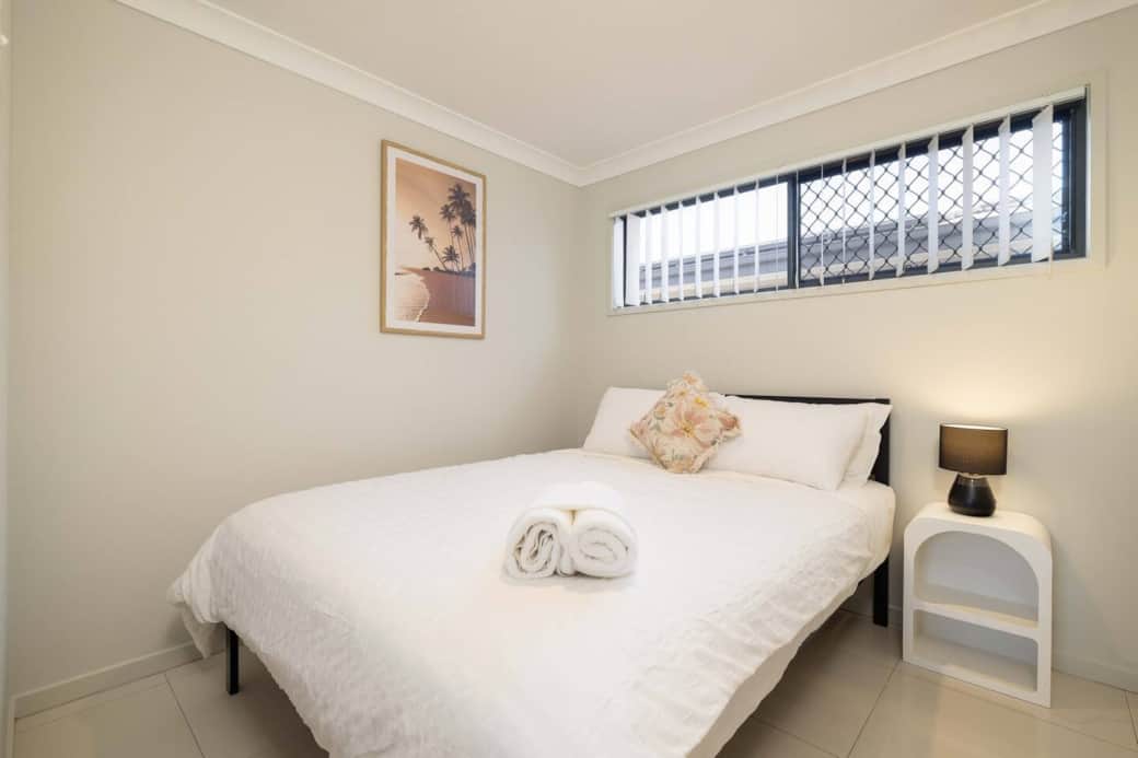 Bedroom 1: Peaceful bedroom with cozy design and ample storage