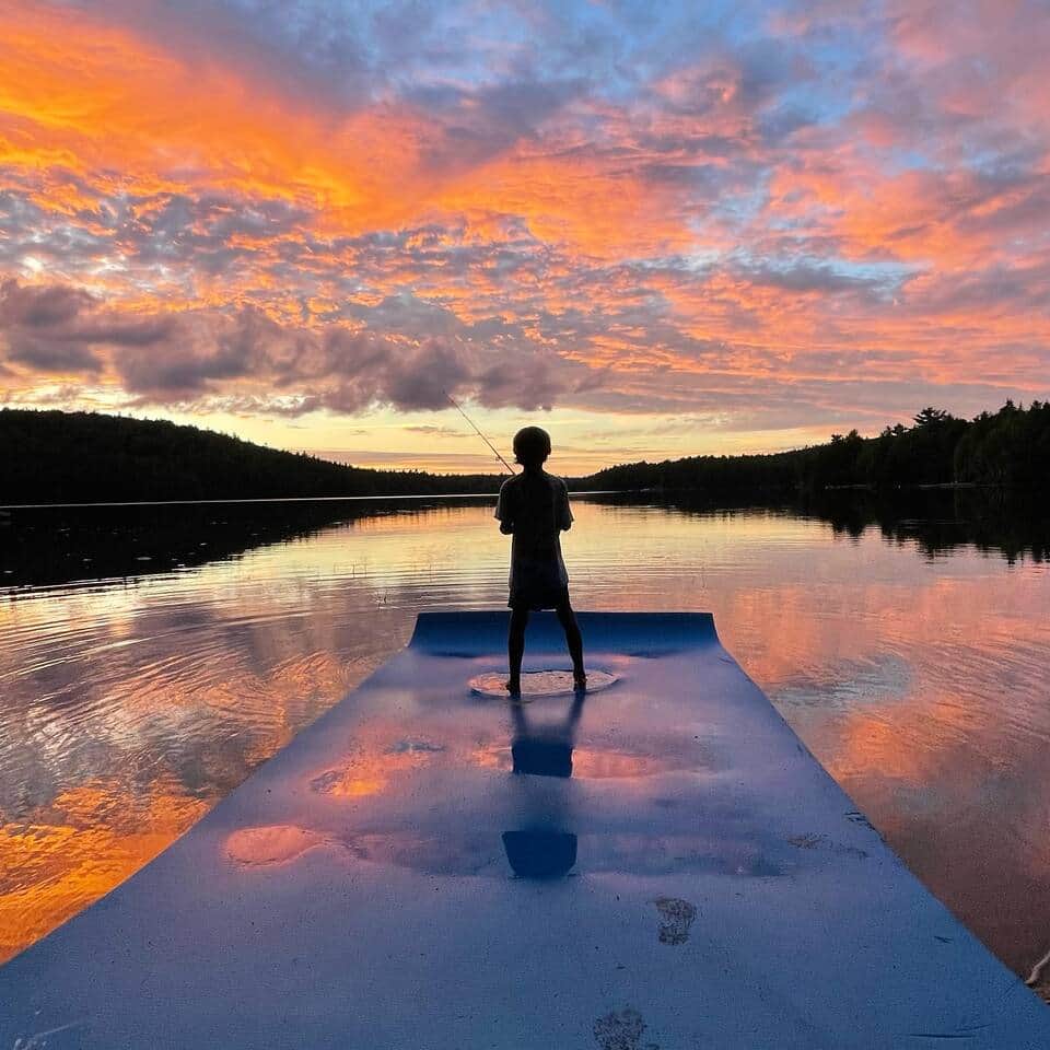 We have a West view of the lake and get spectacular sunsets.  Our guest fishing off the water mat.