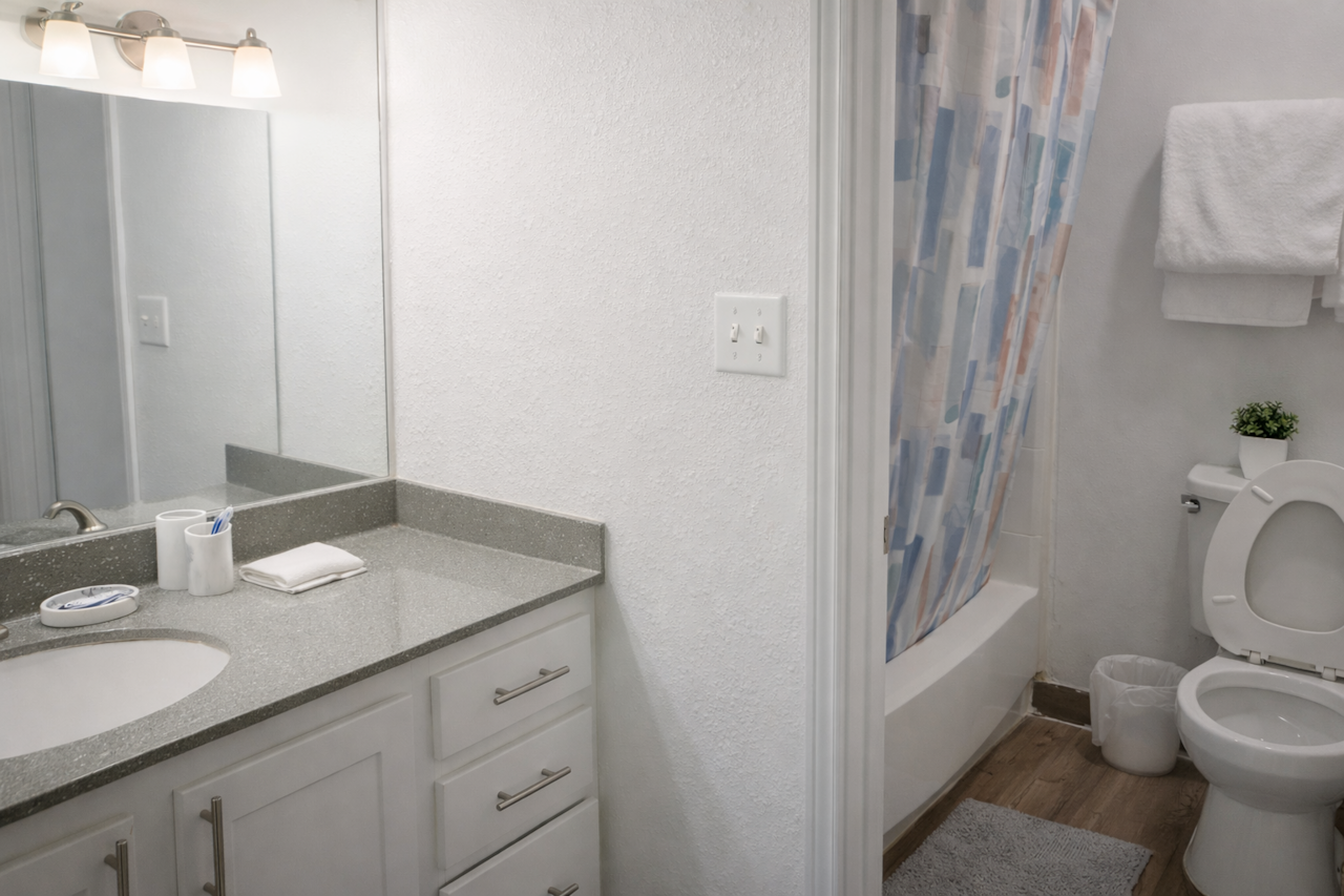 Clean, bright bathroom stocked with essentials for a comfortable stay