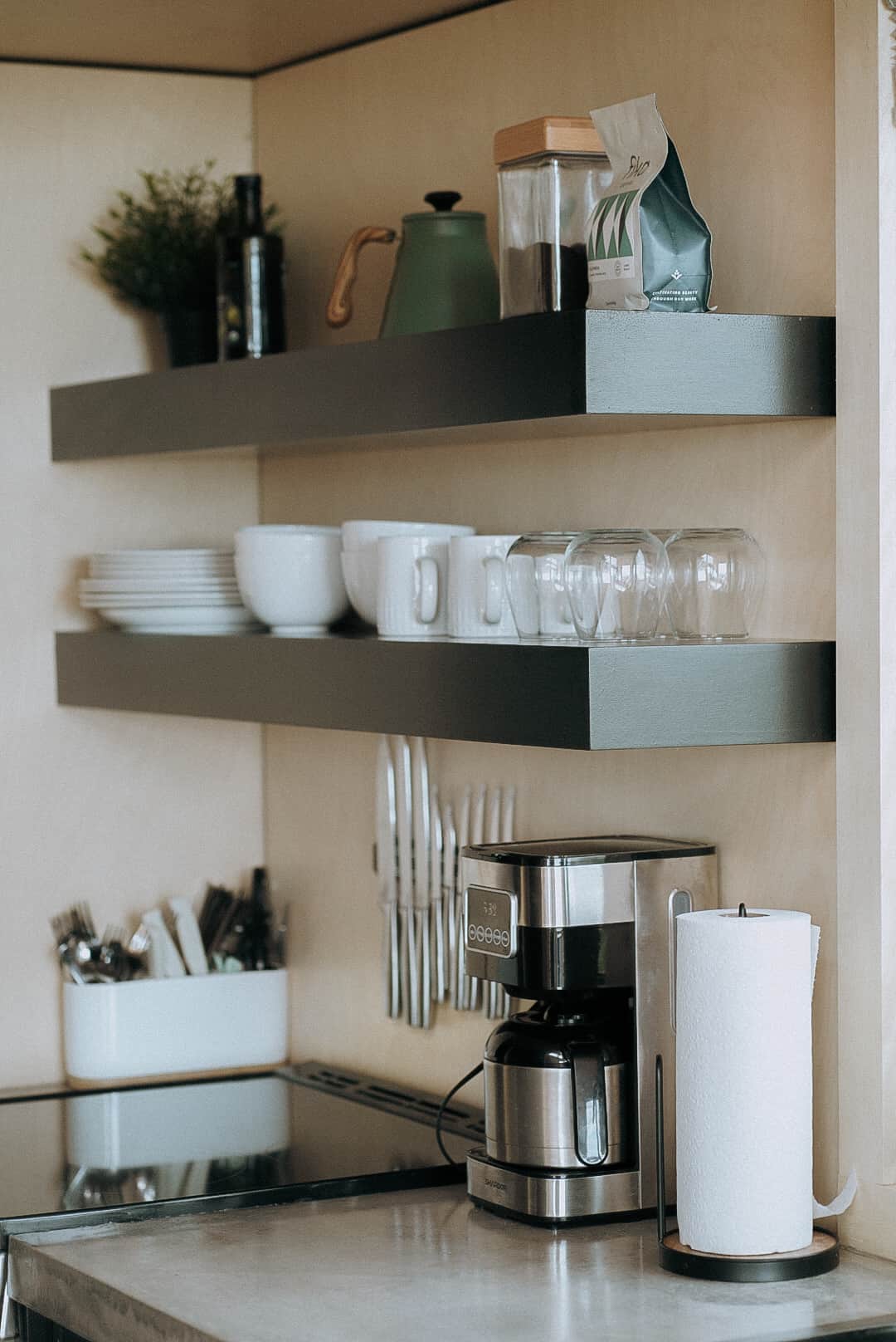 Full kitchen with electric range, fridge, microwave, and coffeepot. S+P, coffee, olive oil
