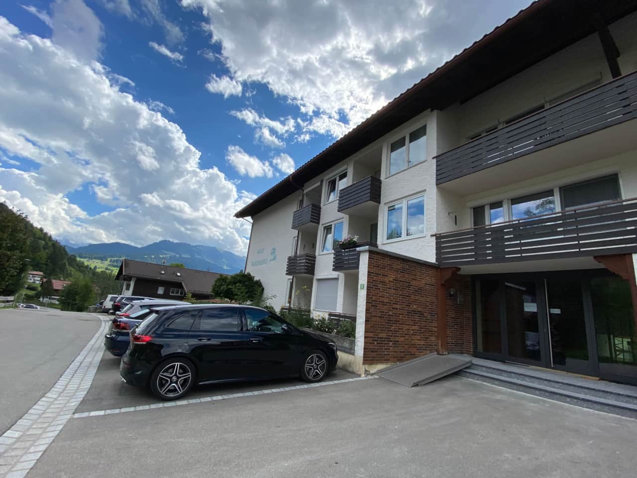 View of the house with ample parking and a quiet street.